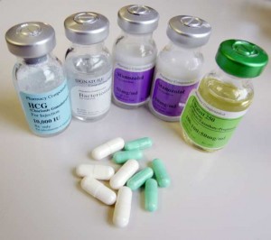 Steroids purchased through the mail by undercover law enforcement officials, vials of HCG (Human chorionic gonadotropin), and Bacteriostatic water, left, 2 vials of Stanozolo, center, and testosterone (cypionate: enanthate: propionate) right, are displayed with white clompiphenene and green anastrozole pills in Albany, N.Y., Feb. 13, 2007. The Albany, N.Y., Times Union reported investigators expected to arrest more than two dozen doctors, pharmacists and business owners on sealed indictments charging them with various felonies for unlawfully distributing steroids and other controlled substances from an Orlando pharmarcy, court records show. (AP Photo/Albany Times Union, Will Waldron ) **CAPITAL REGION AND GLENS FALLS OUT**